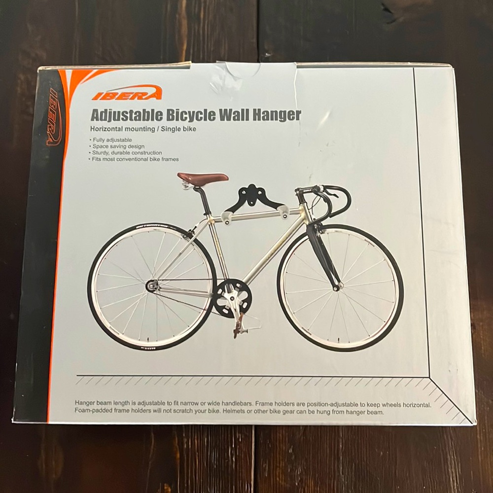 bicycle wall mount- Adjustable & new in box! Perfect to organize garage